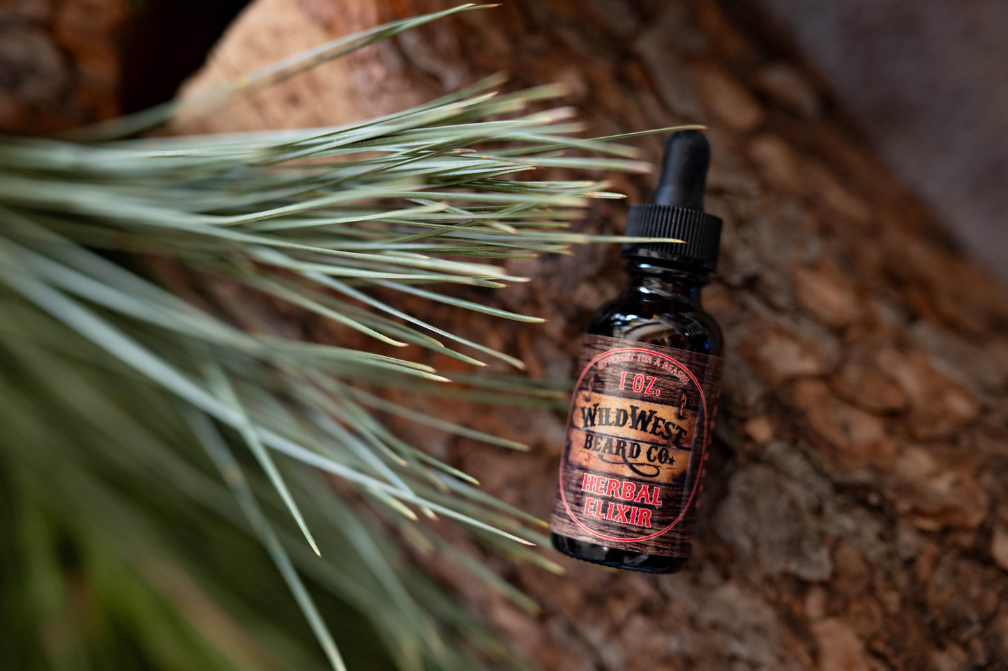 a picture of Herbal Elixir Natural Beard oil on pine