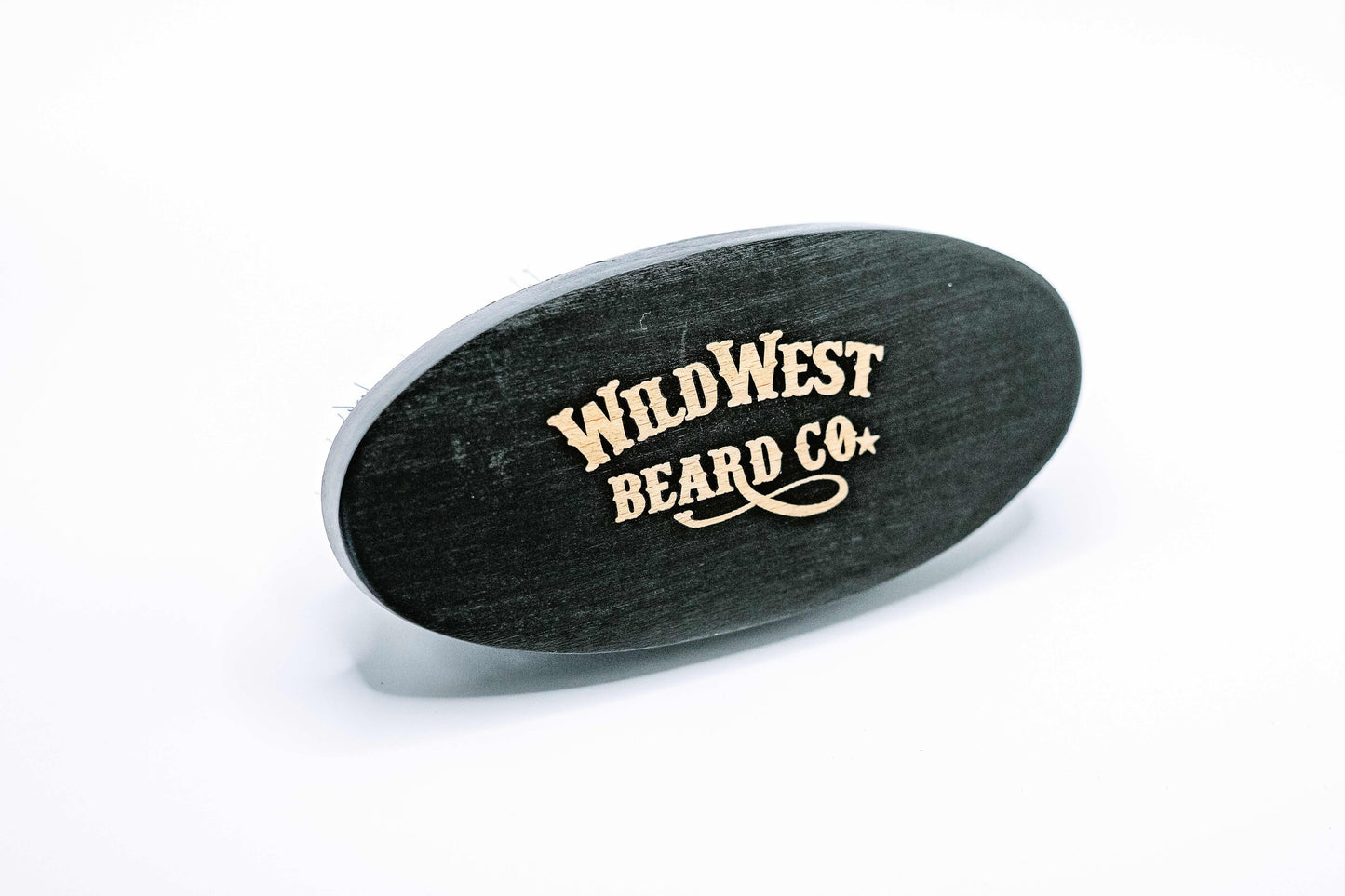 A beech wood boars hair beard brush from Wild West Beard Co.