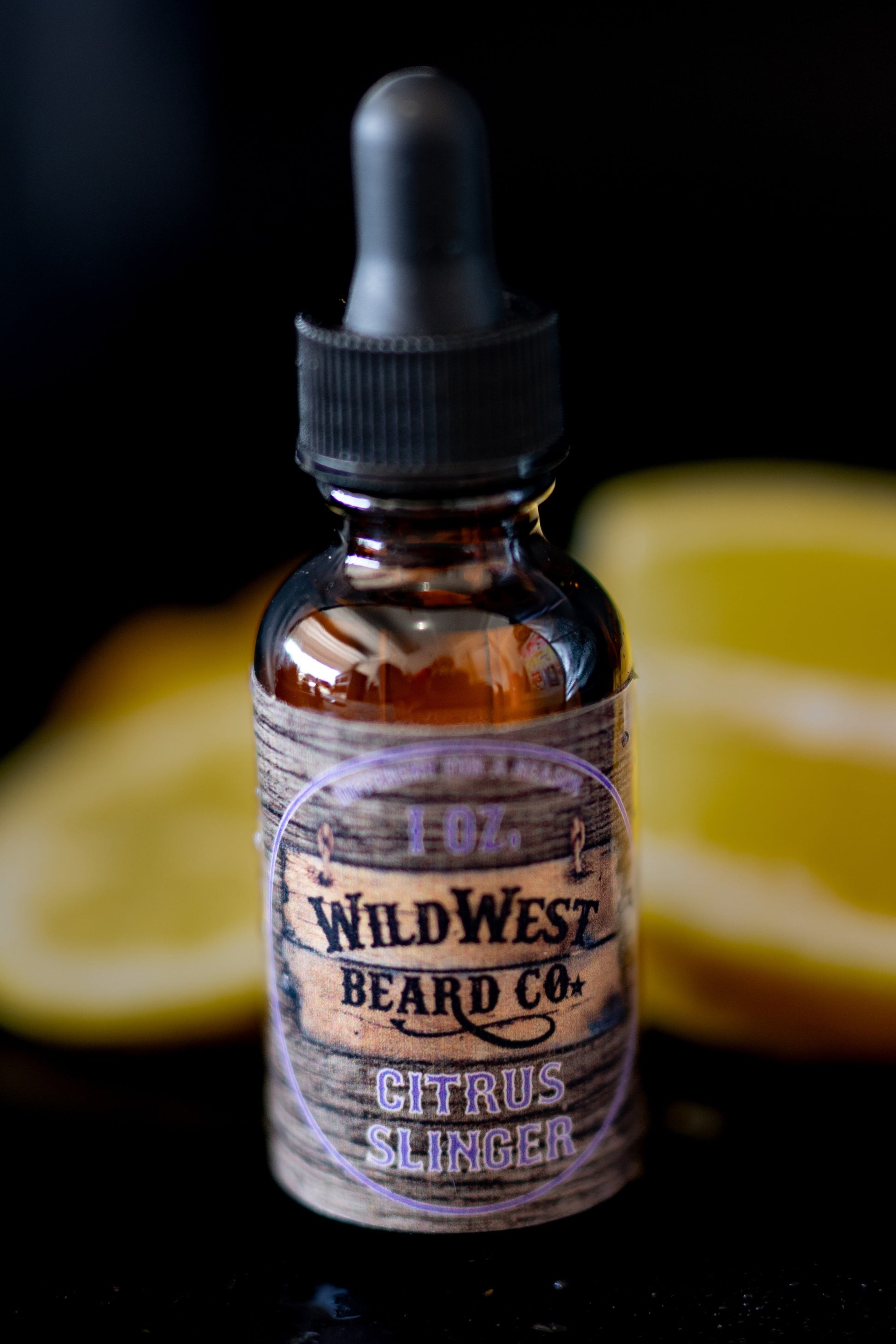 a picture of Citrus Slinger Natural Beard Oil with lemon in the background