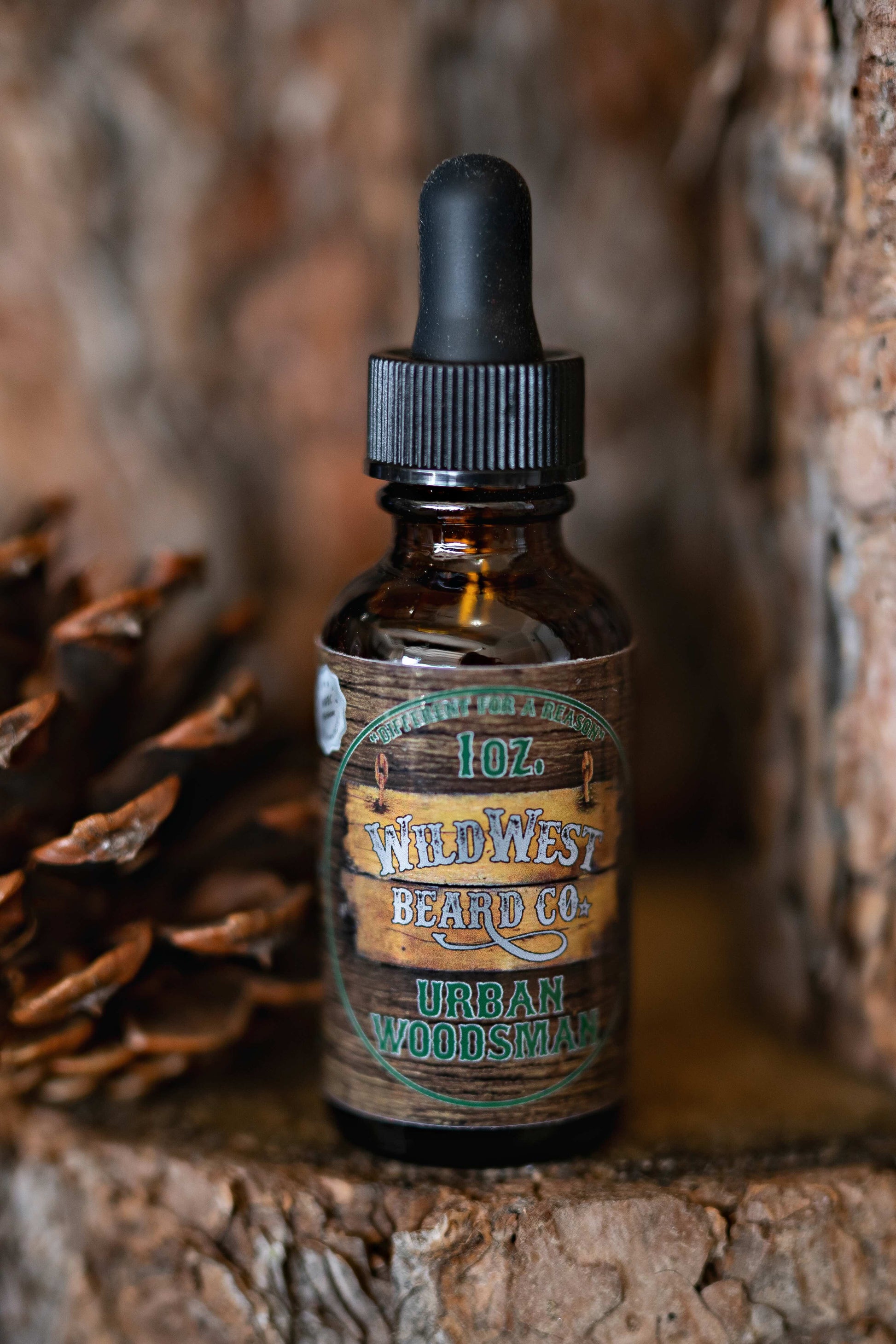 A picture of Urban Woodsman Platinum Beard Oil on pine bark